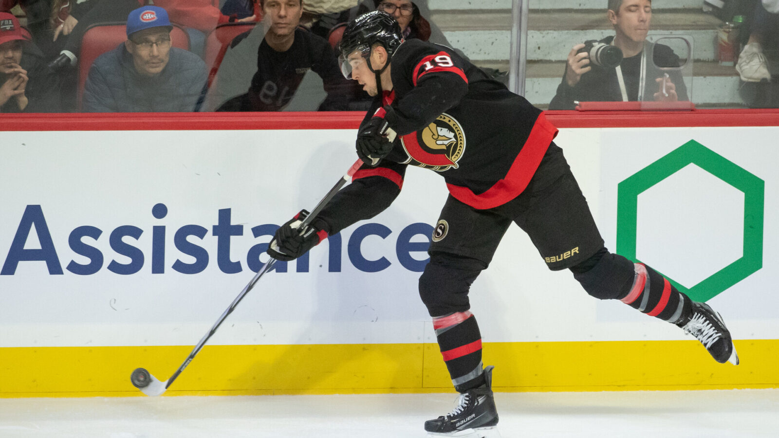 Nov 24 2023; Ottawa, Ontario, CAN; Ottawa Senators right wing Drake Batherson (19) shoots the puck in the third period againstthe New York Islanders at the Canadian Tire Centre.