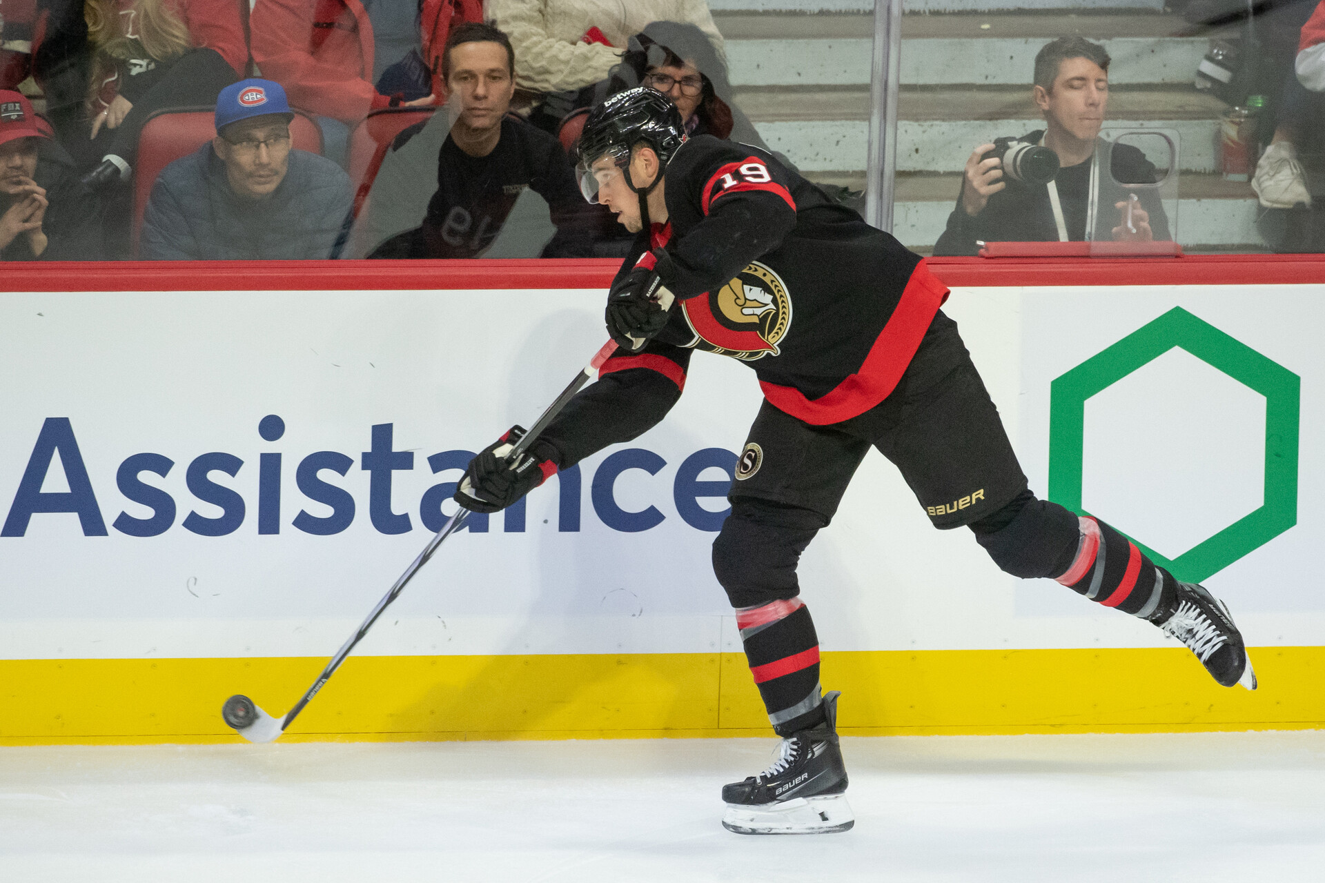 Nov 24 2023; Ottawa, Ontario, CAN; Ottawa Senators right wing Drake Batherson (19) shoots the puck in the third period againstthe New York Islanders at the Canadian Tire Centre.