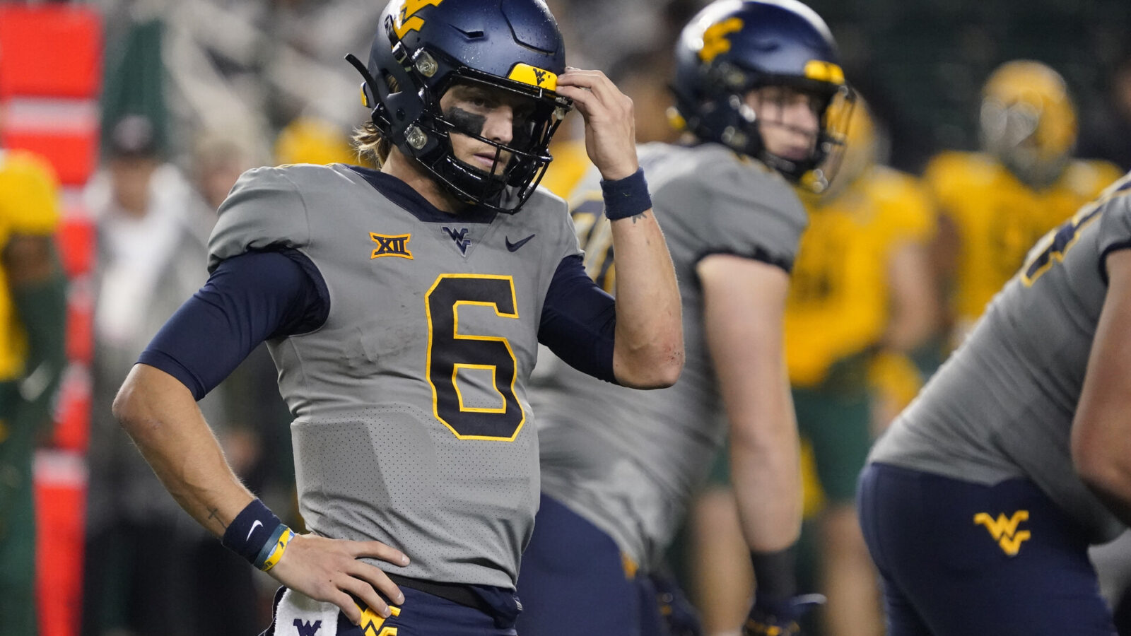 Nov 25, 2023; Waco, Texas, USA; West Virginia Mountaineers quarterback Garrett Greene (6) looks towards the bench pre-snap against the Baylor Bears during the second half at McLane Stadium.
