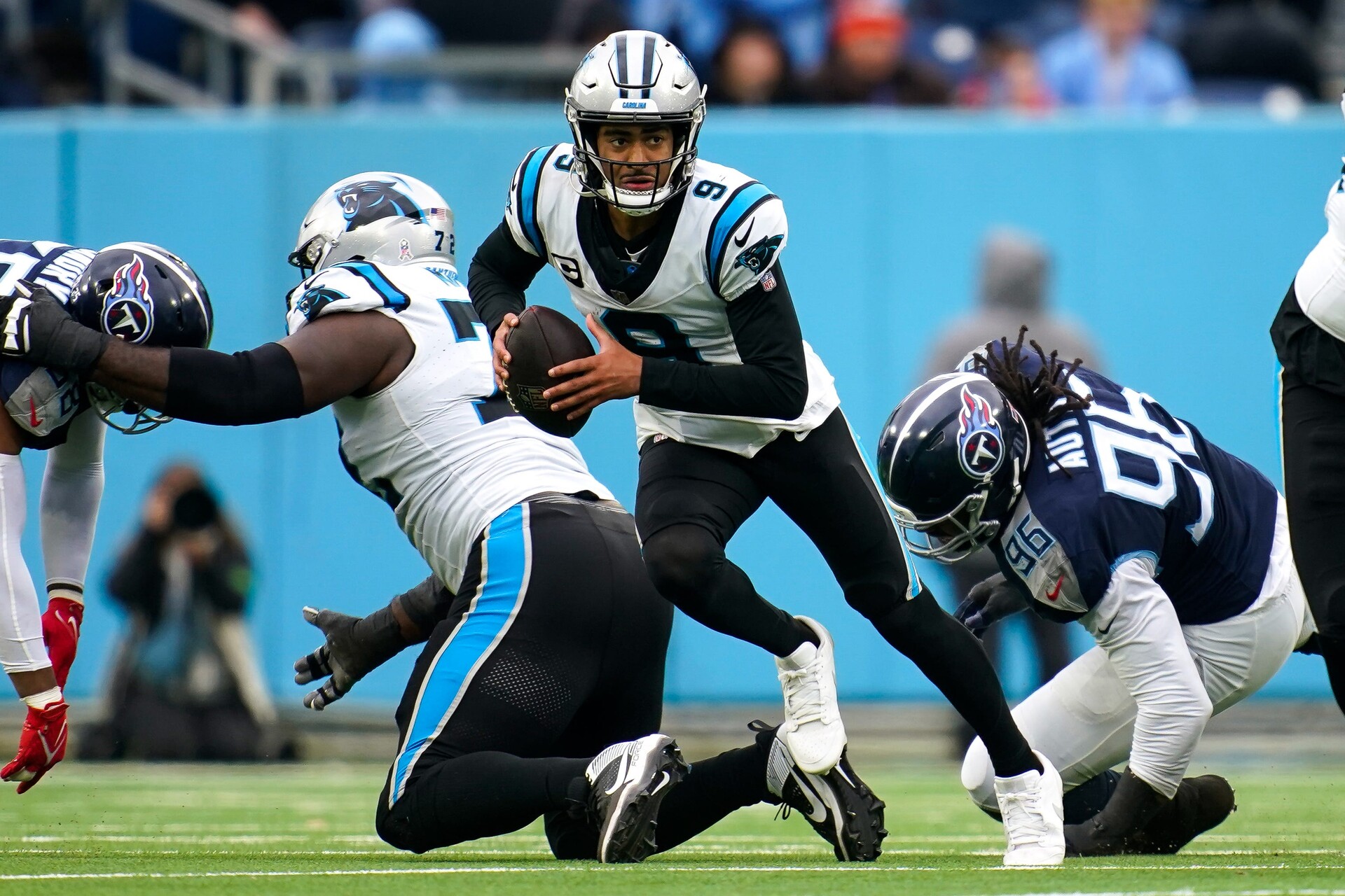 Carolina Panthers quarterback Bryce Young (9) runs the ball against the Tennessee Titans during the third quarter at Nissan Stadium in Nashville, Tenn., Sunday, Nov. 26, 2023.