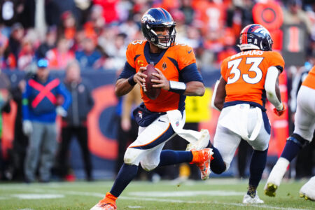 Nov 26, 2023; Denver, Colorado, USA; Denver Broncos quarterback Russell Wilson (3) scrambles in the first half against the Cleveland Browns at Empower Field at Mile High.