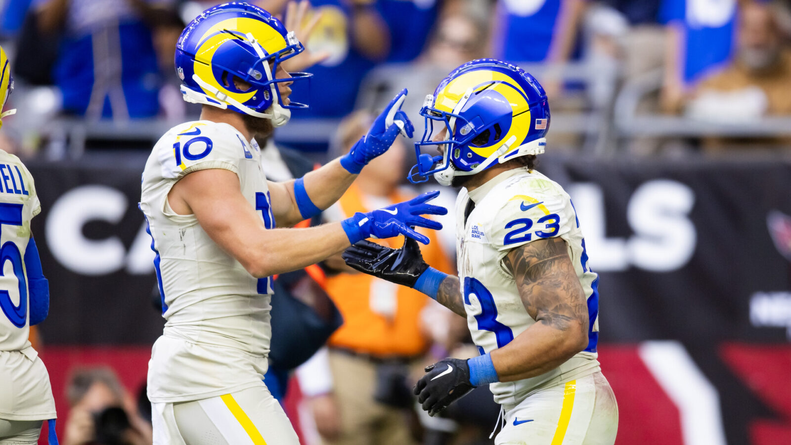 Nov 26, 2023; Glendale, Arizona, USA; Los Angeles Rams running back Kyren Williams (23) celebrates a touchdown with wide receiver Cooper Kupp (10) against the Arizona Cardinals in the first half at State Farm Stadium.