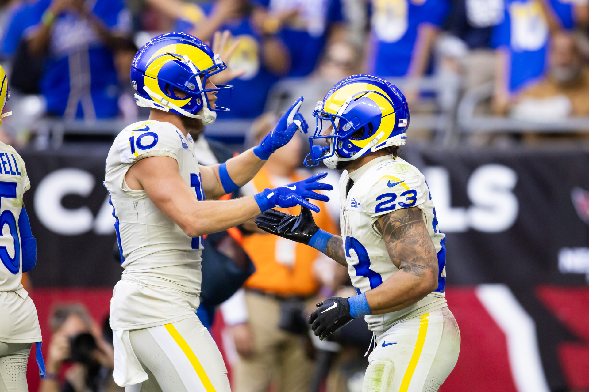 Nov 26, 2023; Glendale, Arizona, USA; Los Angeles Rams running back Kyren Williams (23) celebrates a touchdown with wide receiver Cooper Kupp (10) against the Arizona Cardinals in the first half at State Farm Stadium.