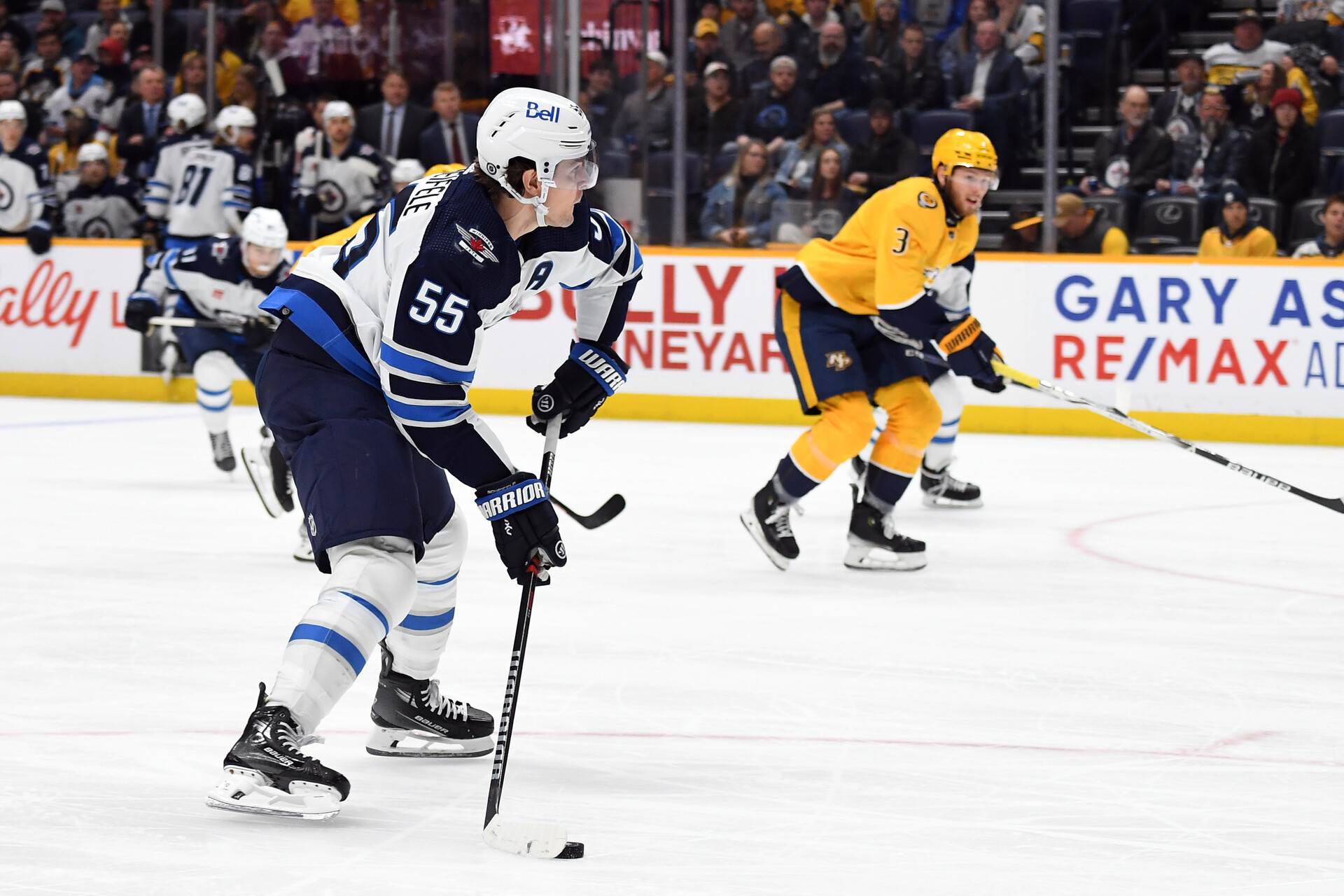 Nov 26, 2023; Nashville, Tennessee, USA; Winnipeg Jets center Mark Scheifele (55) shoots the puck during the second period against the Nashville Predators at Bridgestone Arena.