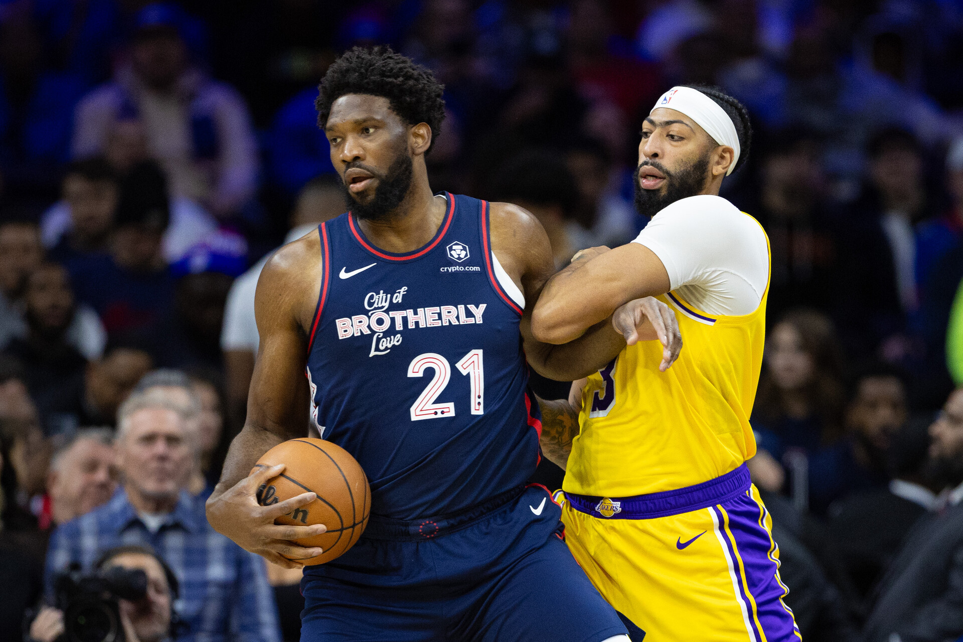 Nov 27, 2023; Philadelphia, Pennsylvania, USA; Philadelphia 76ers center Joel Embiid (21) battles for position against Los Angeles Lakers forward Anthony Davis (3) during the first quarter at Wells Fargo Center.