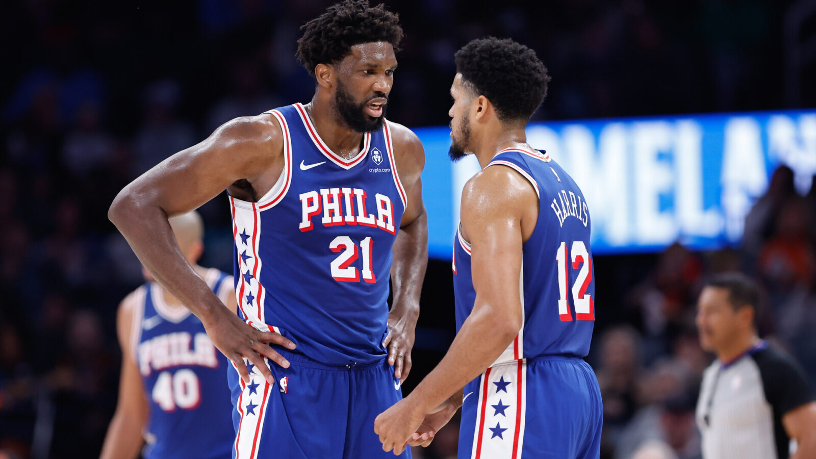 Nov 25, 2023; Oklahoma City, Oklahoma, USA; Philadelphia 76ers center Joel Embiid (21) and forward Tobias Harris (12) talk between plays against the Oklahoma City Thunder during the second half at Paycom Center.