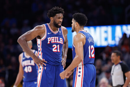 Nov 25, 2023; Oklahoma City, Oklahoma, USA; Philadelphia 76ers center Joel Embiid (21) and forward Tobias Harris (12) talk between plays against the Oklahoma City Thunder during the second half at Paycom Center.