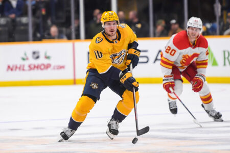 Nov 22, 2023; Nashville, Tennessee, USA; Nashville Predators center Colton Sissons (10) skates against the Calgary Flames during the third period at Bridgestone Arena.