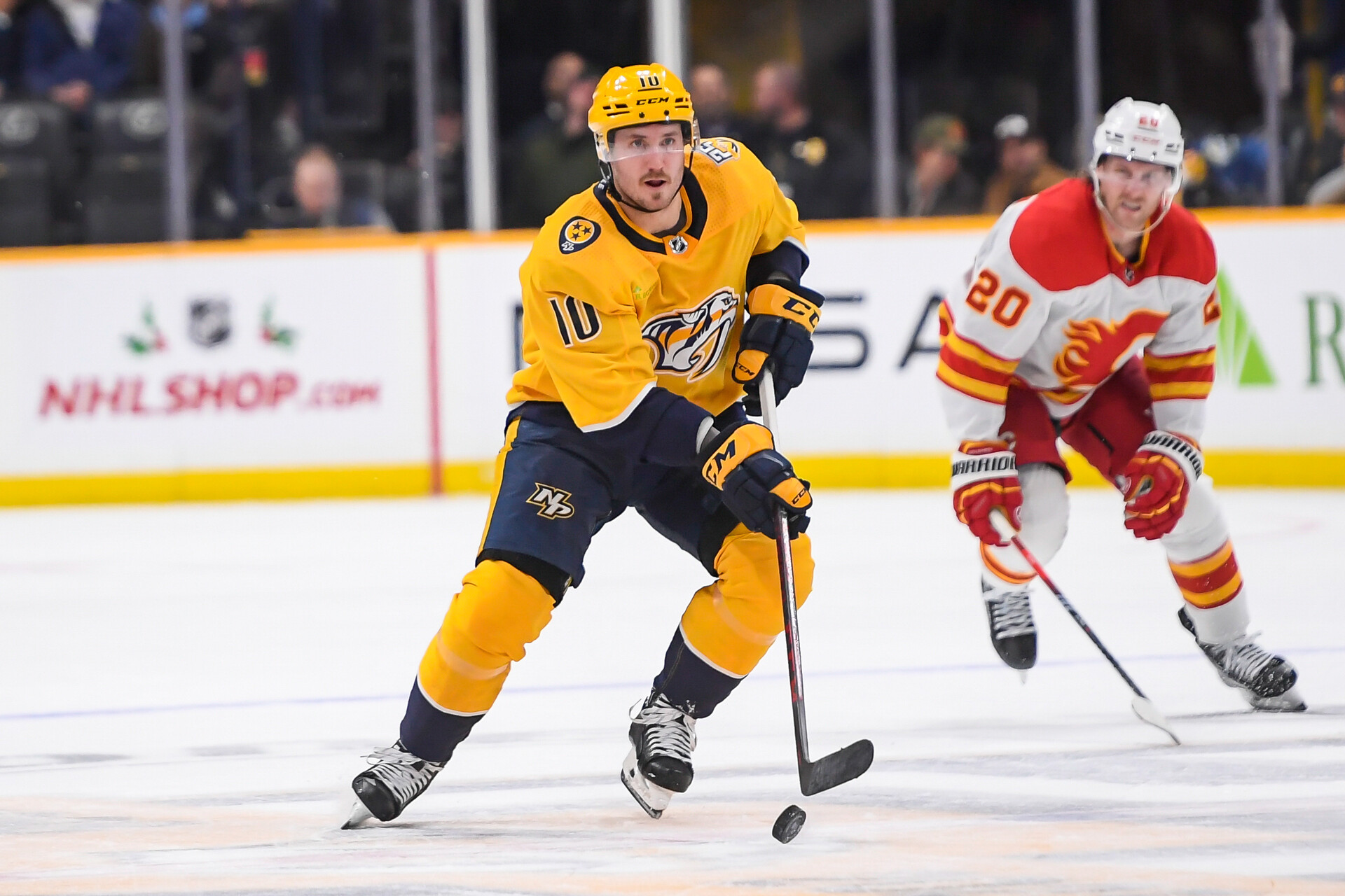 Nov 22, 2023; Nashville, Tennessee, USA; Nashville Predators center Colton Sissons (10) skates against the Calgary Flames during the third period at Bridgestone Arena.