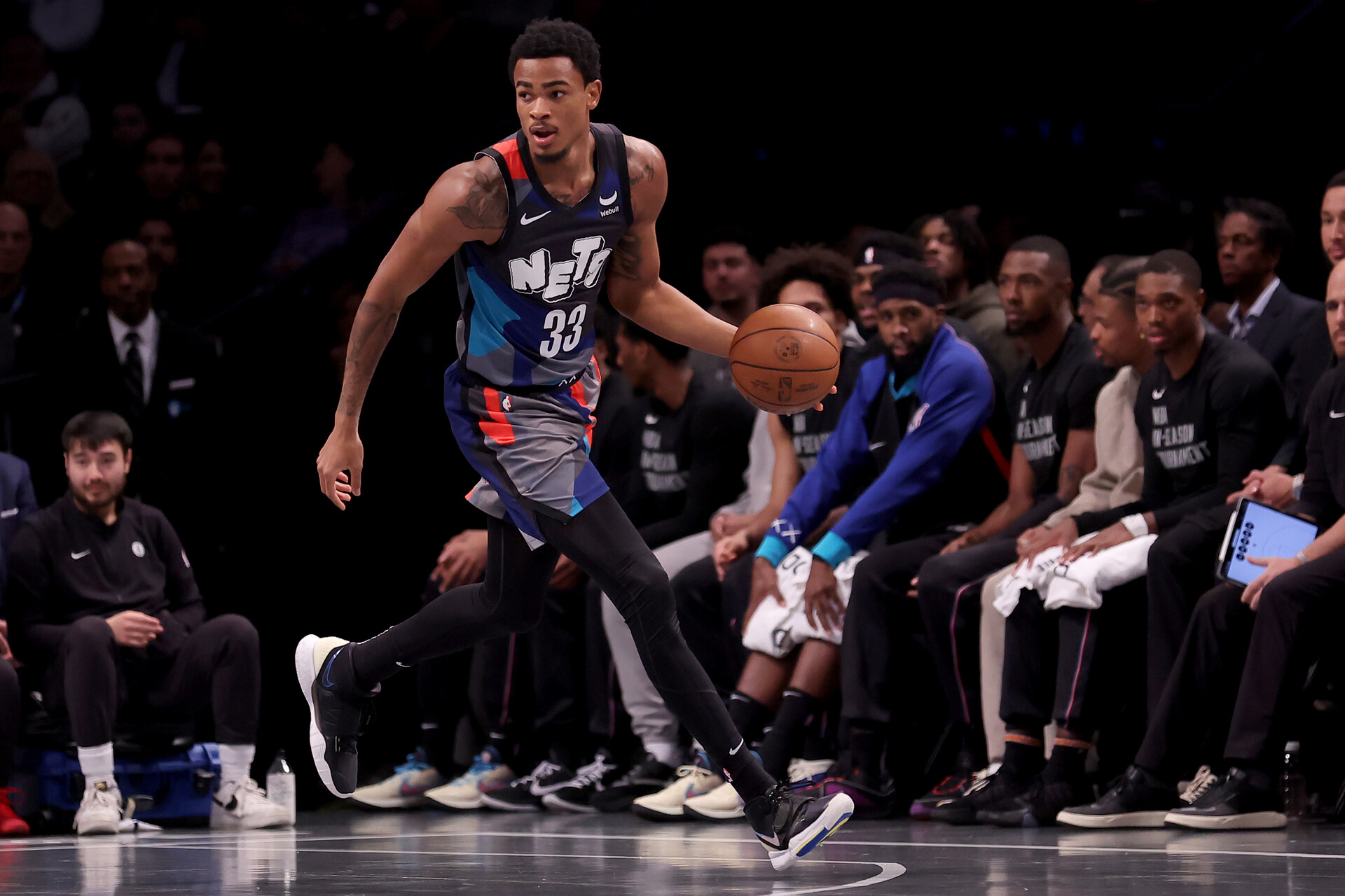 Nov 28, 2023; Brooklyn, New York, USA; Brooklyn Nets center Nic Claxton (33) brings the ball up court against the Toronto Raptors during the first quarter at Barclays Center.