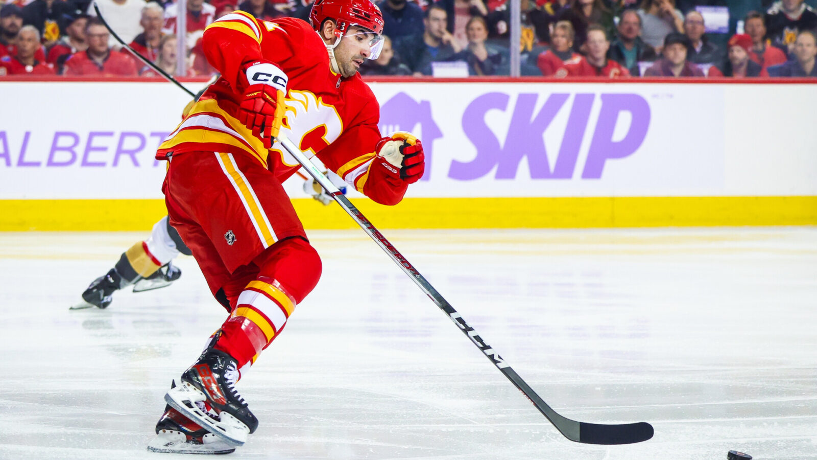 Nov 27, 2023; Calgary, Alberta, CAN; Calgary Flames center Nazem Kadri (91) skates with the puck against the Vegas Golden Knights during the first period at Scotiabank Saddledome