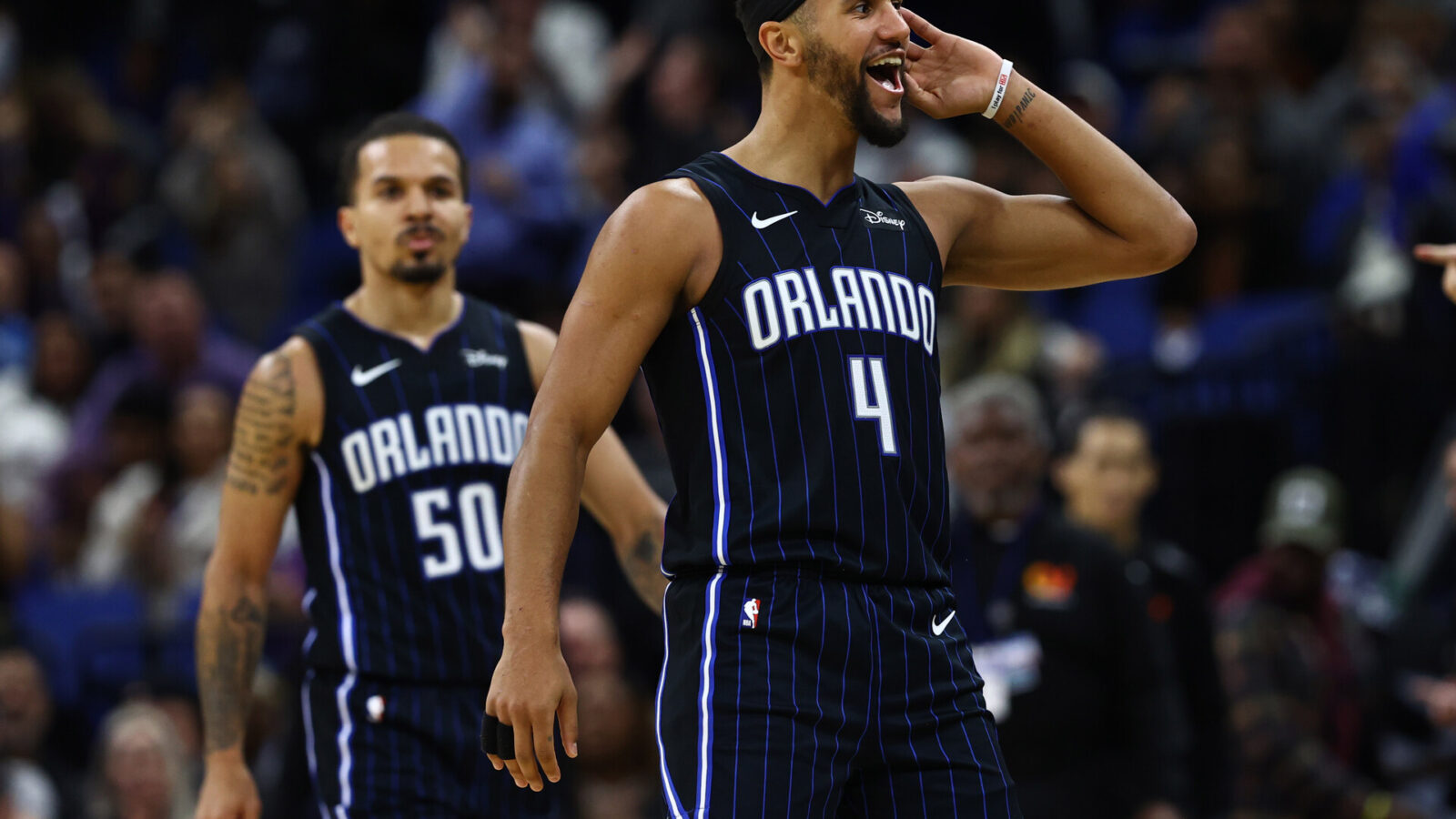 Nov 29, 2023; Orlando, Florida, USA; Orlando Magic guards Jalen Suggs (4) and Cole Anthony (50) celebrate after a basket against the Washington Wizards during the second half at Amway Center.