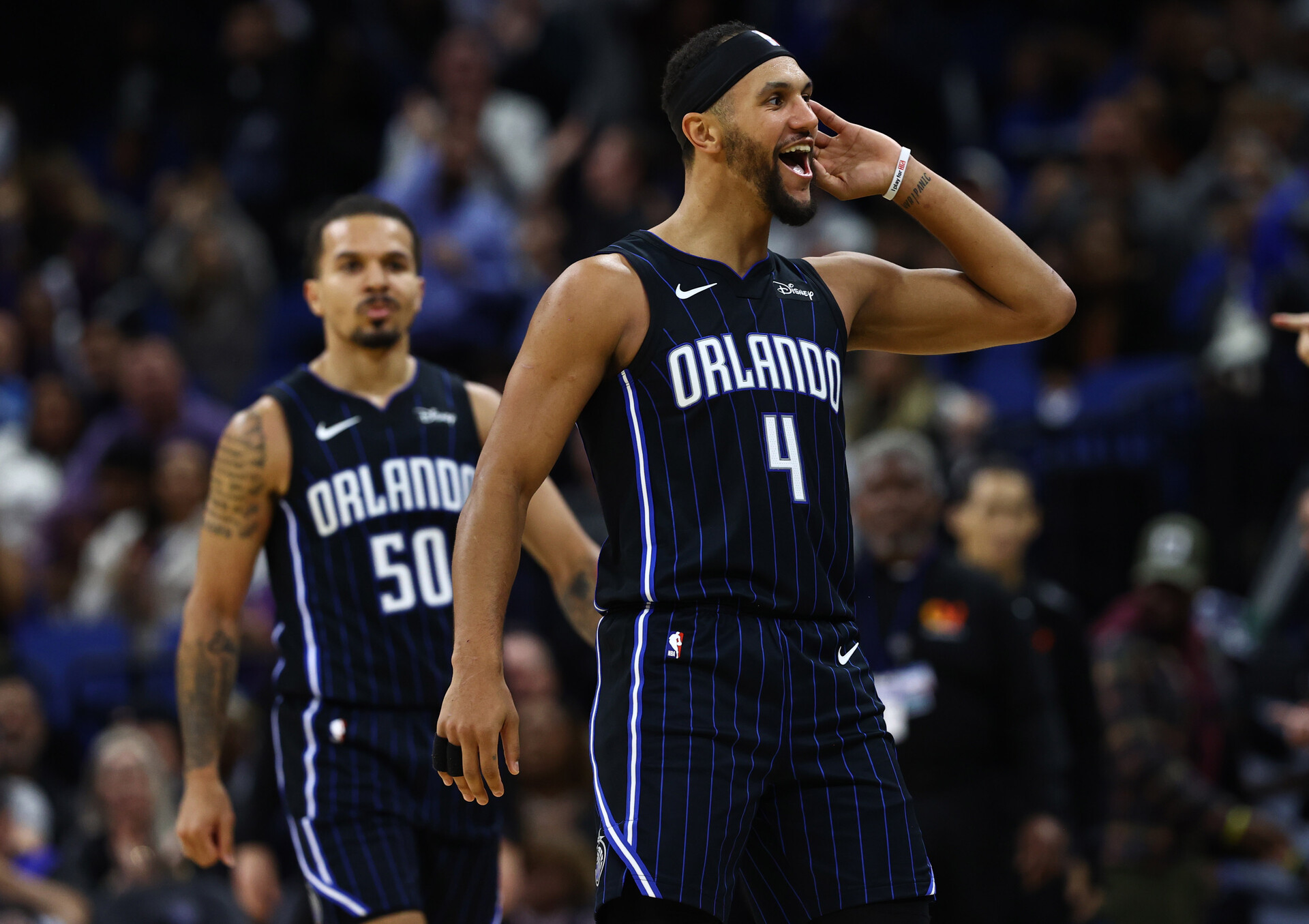Nov 29, 2023; Orlando, Florida, USA; Orlando Magic guards Jalen Suggs (4) and Cole Anthony (50) celebrate after a basket against the Washington Wizards during the second half at Amway Center.