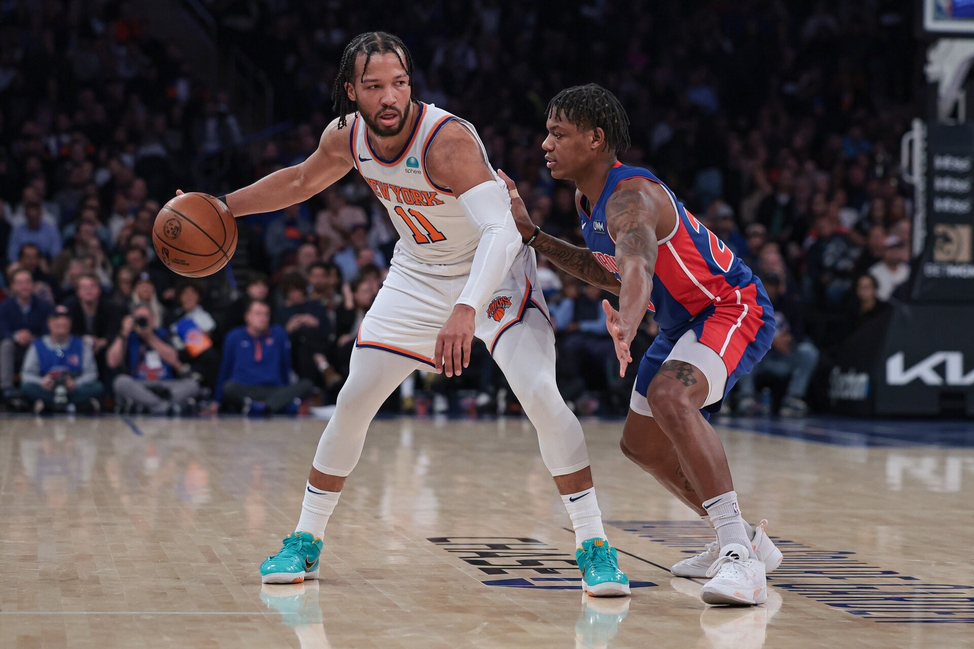 Nov 30, 2023; New York, New York, USA; New York Knicks guard Jalen Brunson (11) dribbles as Detroit Pistons guard Marcus Sasser (25) defends during the first half at Madison Square Garden.