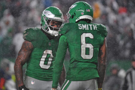 Philadelphia Eagles wide receiver DeVonta Smith (6) celebrates his touchdown catch with running back D'Andre Swift (0) against the Buffalo Bills at Lincoln Financial Field.