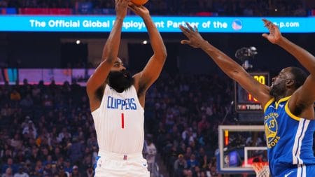 Nov 30, 2023; San Francisco, California, USA; Los Angeles Clippers guard James Harden (1) shoots the ball against Golden State Warriors forward Draymond Green (23) during the first quarter at Chase Center.