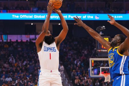 Nov 30, 2023; San Francisco, California, USA; Los Angeles Clippers guard James Harden (1) shoots the ball against Golden State Warriors forward Draymond Green (23) during the first quarter at Chase Center.