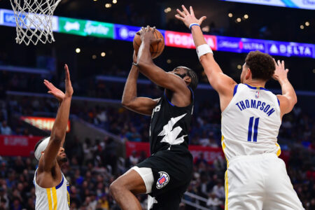 Dec 2, 2023; Los Angeles, California, USA; Los Angeles Clippers guard James Harden (1) moves to the basket against Golden State Warriors guard Klay Thompson (11) and forward Kevon Looney (5) during the second