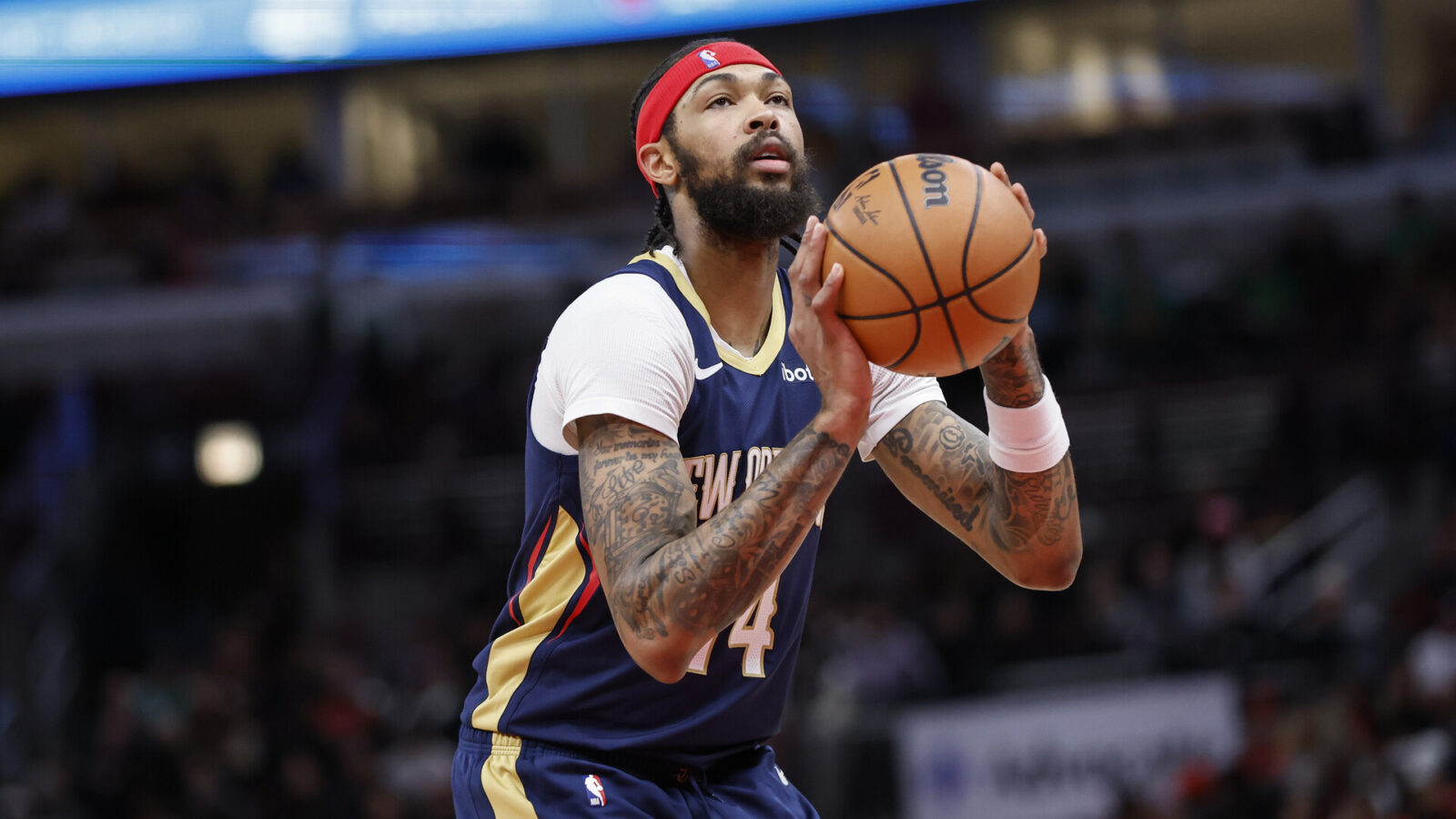 Dec 2, 2023; Chicago, Illinois, USA; New Orleans Pelicans forward Brandon Ingram (14) shoots a free throw against the Chicago Bulls during the first half at United Center.
