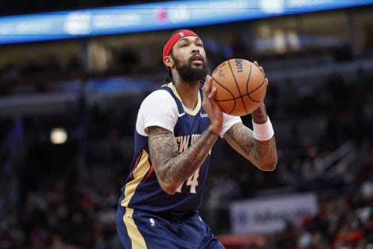 Dec 2, 2023; Chicago, Illinois, USA; New Orleans Pelicans forward Brandon Ingram (14) shoots a free throw against the Chicago Bulls during the first half at United Center.