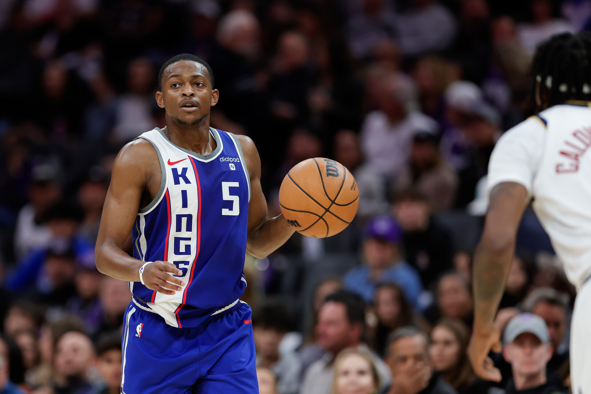 Sacramento Kings guard De'Aaron Fox (5) dribbles the ball up the court during the third quarter against the Denver Nuggets at Golden 1 Center.
