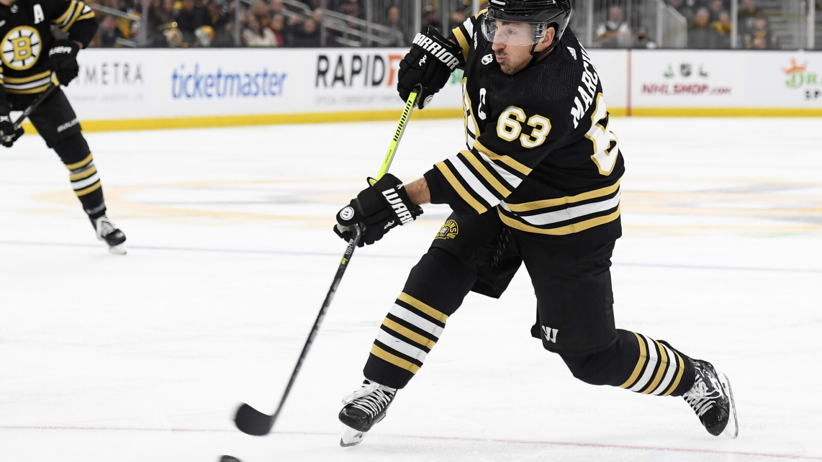 Dec 3, 2023; Boston, Massachusetts, USA; Boston Bruins left wing Brad Marchand (63) shoots the puck during the third period against the Columbus Blue Jackets at TD Garden.