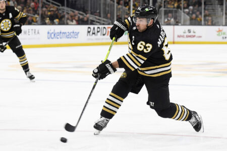 Dec 3, 2023; Boston, Massachusetts, USA; Boston Bruins left wing Brad Marchand (63) shoots the puck during the third period against the Columbus Blue Jackets at TD Garden.