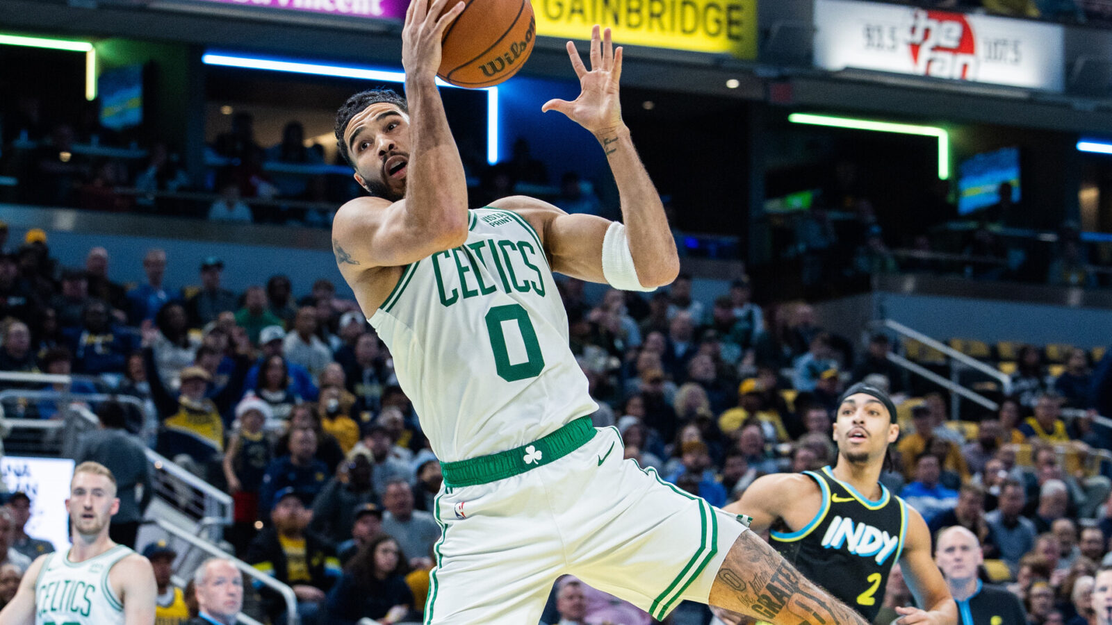 Dec 4, 2023; Indianapolis, Indiana, USA; Boston Celtics forward Jayson Tatum (0) rebounds the ball in the first half against the Indiana Pacers at Gainbridge Fieldhouse.