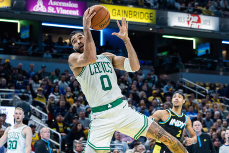 Dec 4, 2023; Indianapolis, Indiana, USA; Boston Celtics forward Jayson Tatum (0) rebounds the ball in the first half against the Indiana Pacers at Gainbridge Fieldhouse.