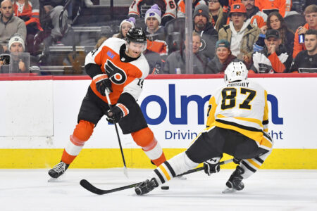 Dec 4, 2023; Philadelphia, Pennsylvania, USA; Philadelphia Flyers center Sean Couturier (14) and Pittsburgh Penguins center Sidney Crosby (87) battle for the puck during the third period at Wells Fargo Center.