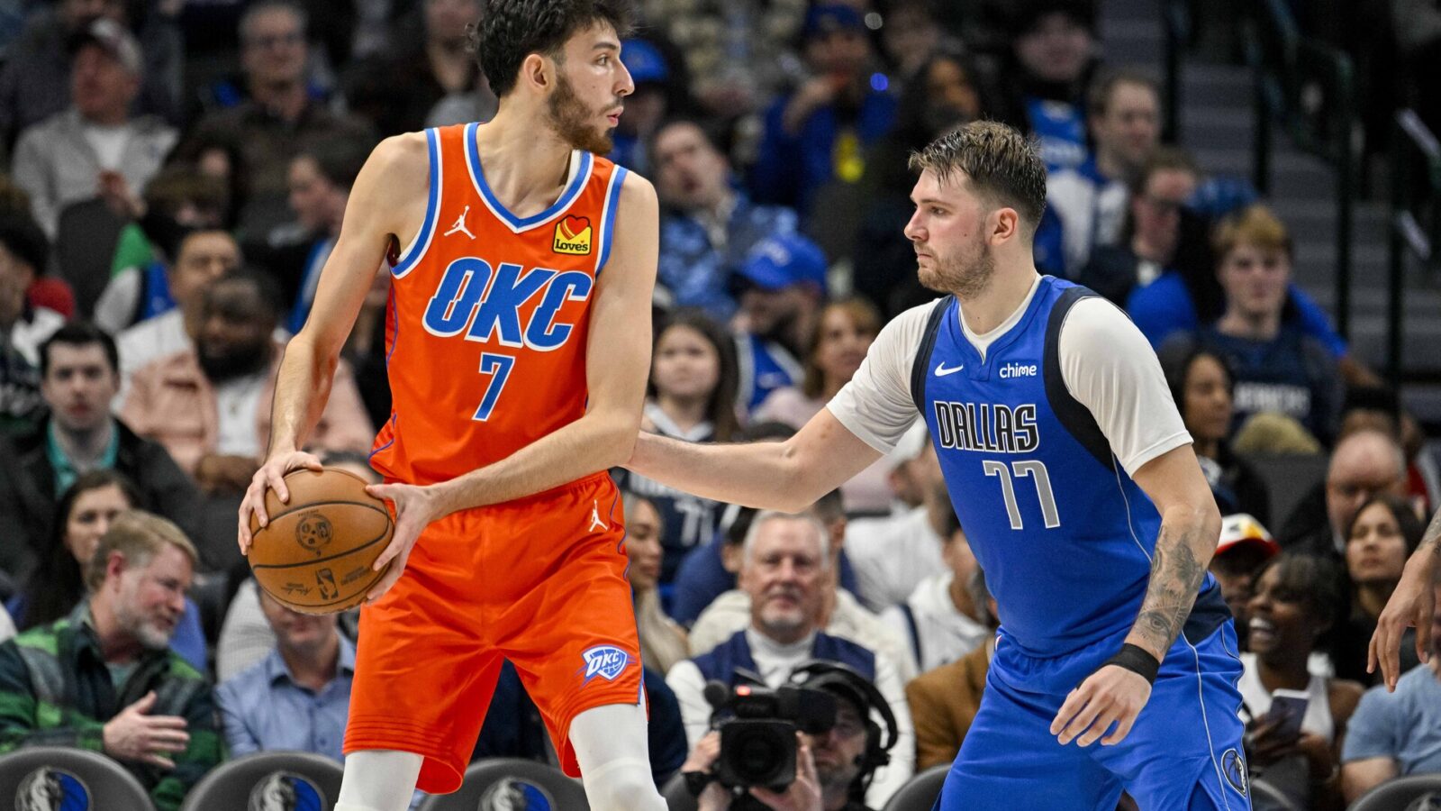 Dec 2, 2023; Dallas, Texas, USA; Oklahoma City Thunder forward Chet Holmgren (7) and Dallas Mavericks guard Luka Doncic (77) in action during the game between the Dallas Mavericks and the Oklahoma City Thunder at the American Airlines Center.