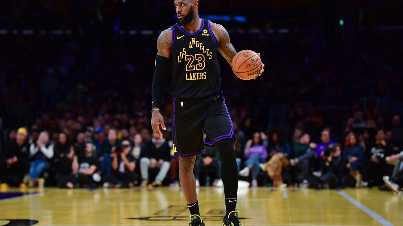 Dec 5, 2023; Los Angeles, California, USA; Los Angeles Lakers forward LeBron James (23) controls the ball against the Phoenix Suns during the first half of the In Season Tournament quarterfinal at Crypto.com Arena.