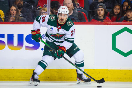 Dec 5, 2023; Calgary, Alberta, CAN; Minnesota Wild right wing Mats Zuccarello (36) controls the puck against the Calgary Flames during the first period at Scotiabank Saddledome