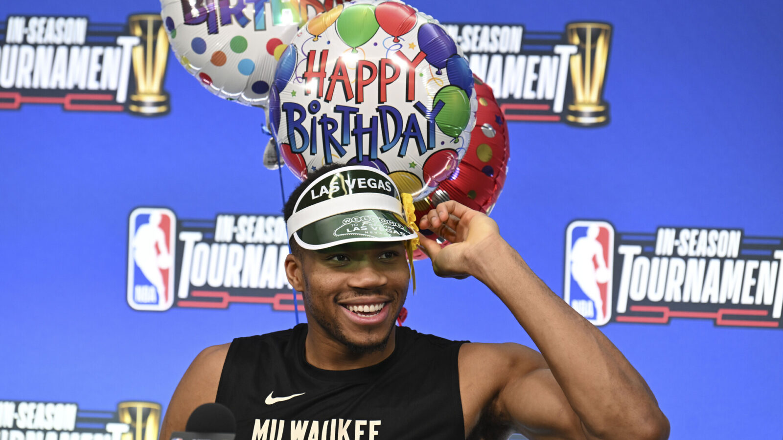 Dec 6, 2023; Las Vegas, NV, USA; Milwaukee Bucks forward Giannis Antetokounmpo (34) puts on a hat to celebrate his birthday during a press conference on practice day prior to the In-Season Tournament semi-finals at T-Mobile Arena.