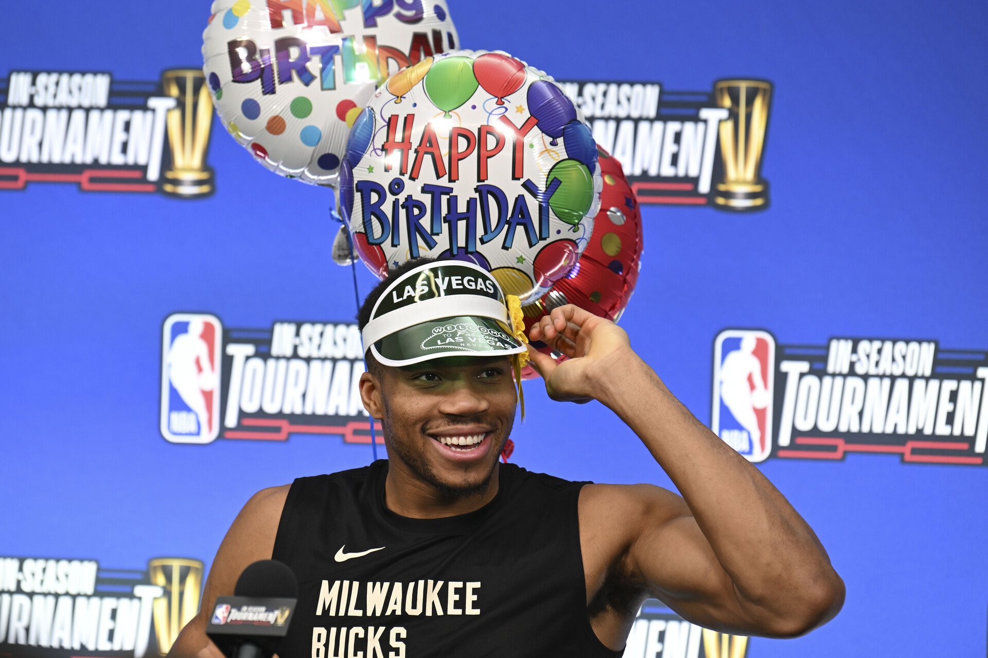 Dec 6, 2023; Las Vegas, NV, USA; Milwaukee Bucks forward Giannis Antetokounmpo (34) puts on a hat to celebrate his birthday during a press conference on practice day prior to the In-Season Tournament semi-finals at T-Mobile Arena.