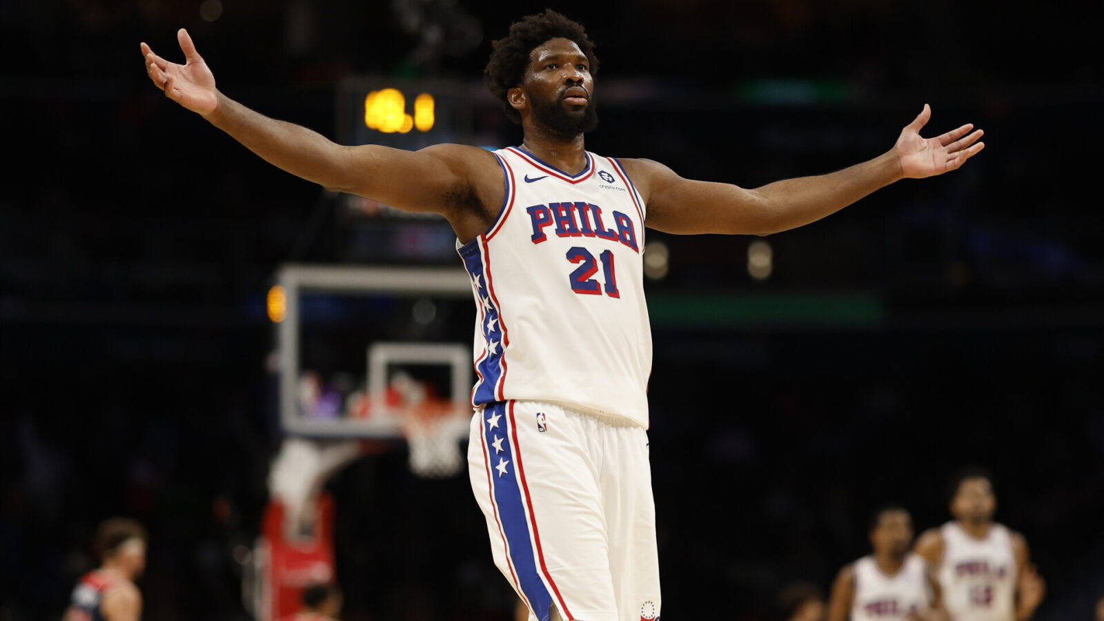 Dec 6, 2023; Washington, District of Columbia, USA; Philadelphia 76ers center Joel Embiid (21) celebrates after scoring his 50th point of the game against the Washington Wizards in the fourth quarter at Capital One Arena.