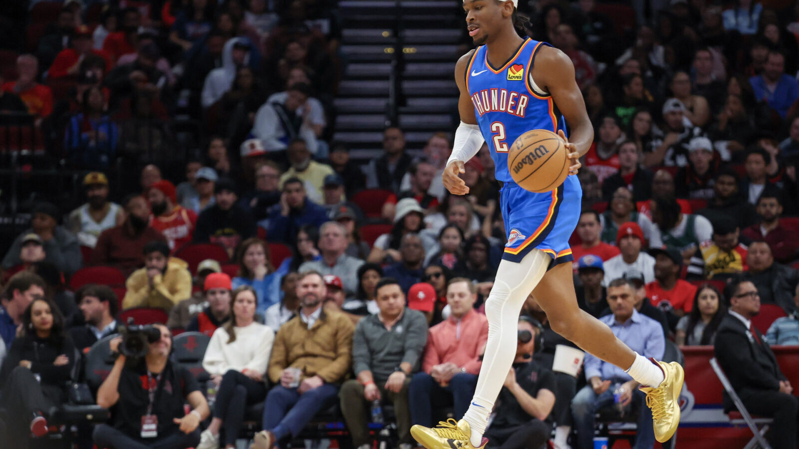 Dec 6, 2023; Houston, Texas, USA; Oklahoma City Thunder guard Shai Gilgeous-Alexander (2) dribbles against the Houston Rockets in the second half at Toyota Center.