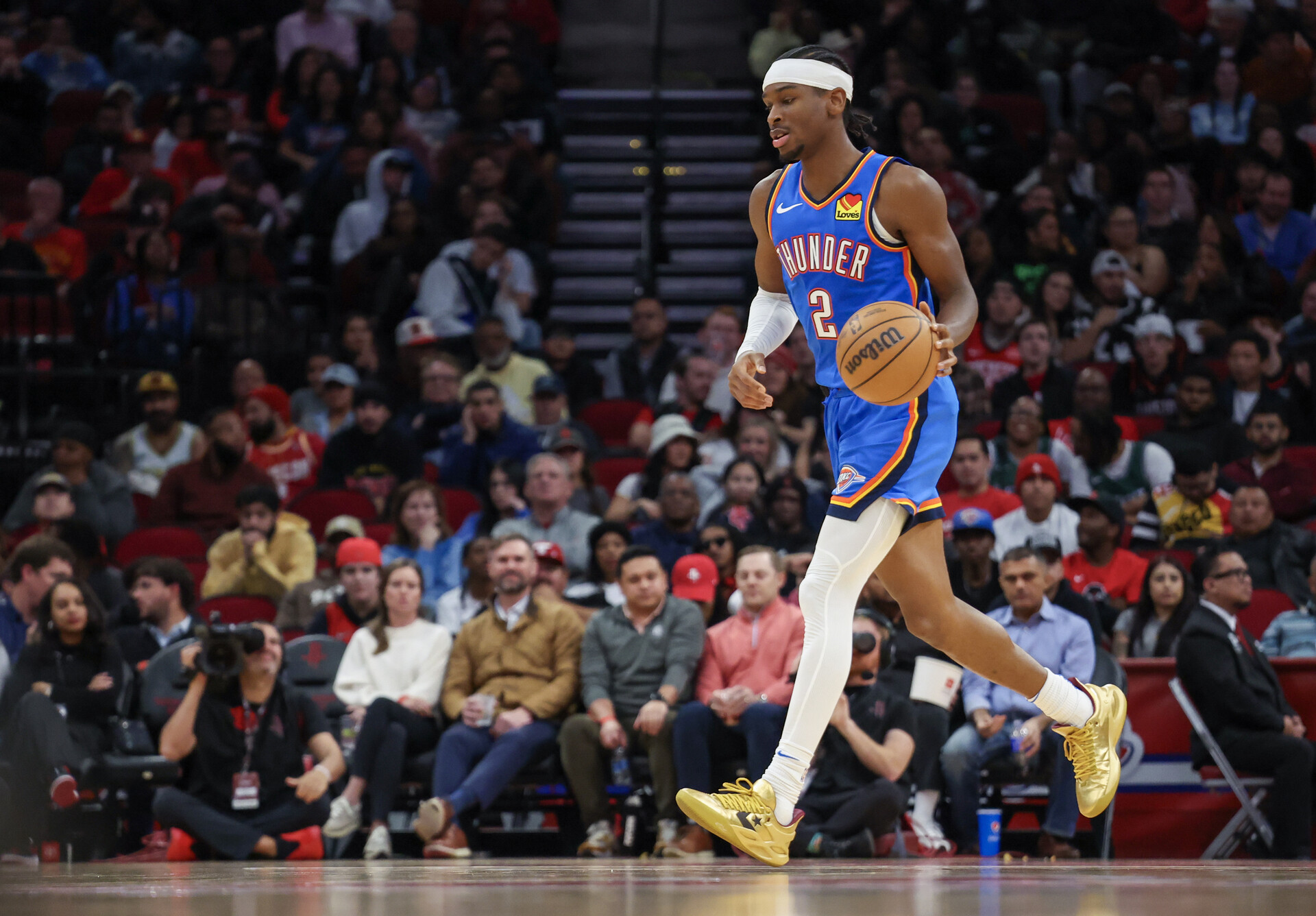 Dec 6, 2023; Houston, Texas, USA; Oklahoma City Thunder guard Shai Gilgeous-Alexander (2) dribbles against the Houston Rockets in the second half at Toyota Center.