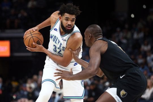 Minnesota Timberwolves center-forward Karl-Anthony Towns (32) handles the ball as Memphis Grizzlies center Bismack Biyombo (18) defends during the first half at FedExForum.