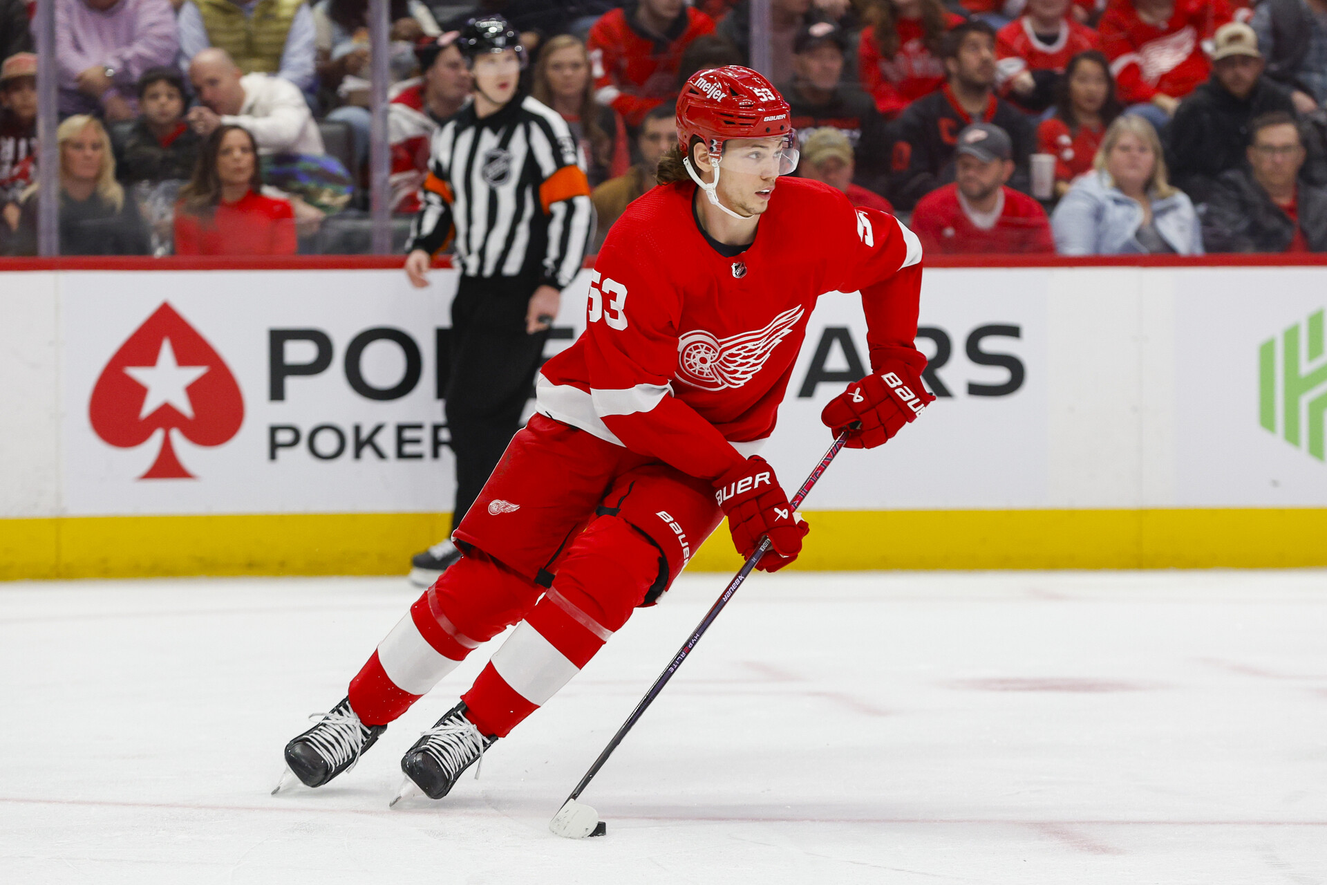 Dec 9, 2023; Detroit, Michigan, USA; Detroit Red Wings defenseman Moritz Seider (53) handles the puck during the first period at Little Caesars Arena.