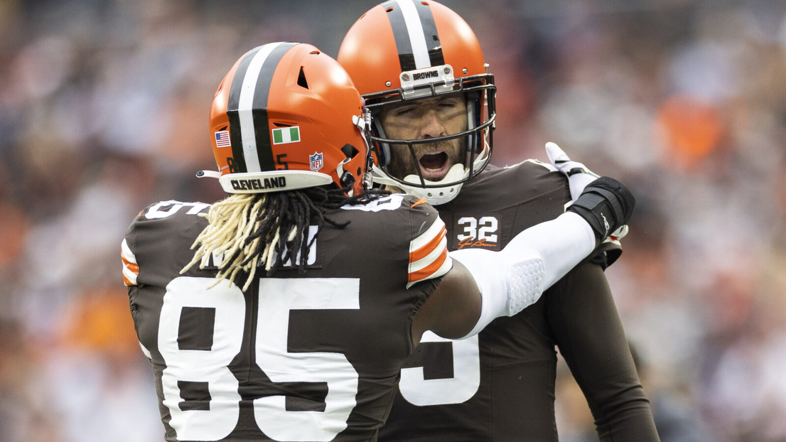 Cleveland Browns quarterback Joe Flacco (15) congratulates tight end David Njoku (85) on his touchdown run against the Jacksonville Jaguars during the second quarter at Cleveland Browns Stadium.