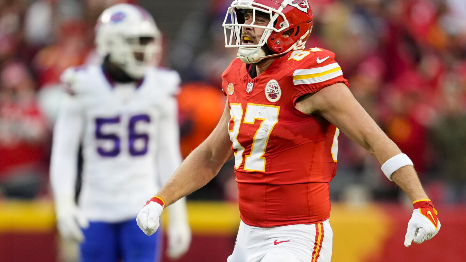 Kansas City Chiefs tight end Travis Kelce (87) celebrates after a first down against the Buffalo Bills during the first half at GEHA Field at Arrowhead Stadium.