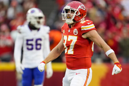 Kansas City Chiefs tight end Travis Kelce (87) celebrates after a first down against the Buffalo Bills during the first half at GEHA Field at Arrowhead Stadium.