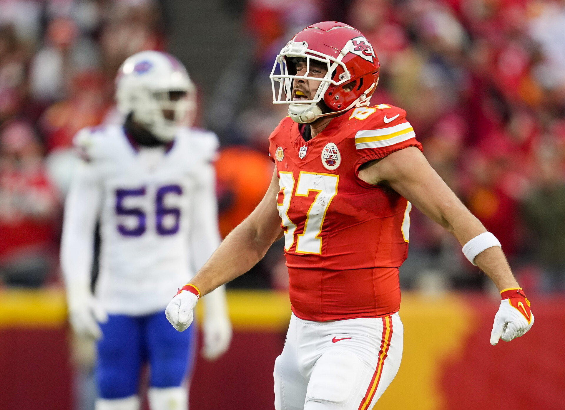 Kansas City Chiefs tight end Travis Kelce (87) celebrates after a first down against the Buffalo Bills during the first half at GEHA Field at Arrowhead Stadium.