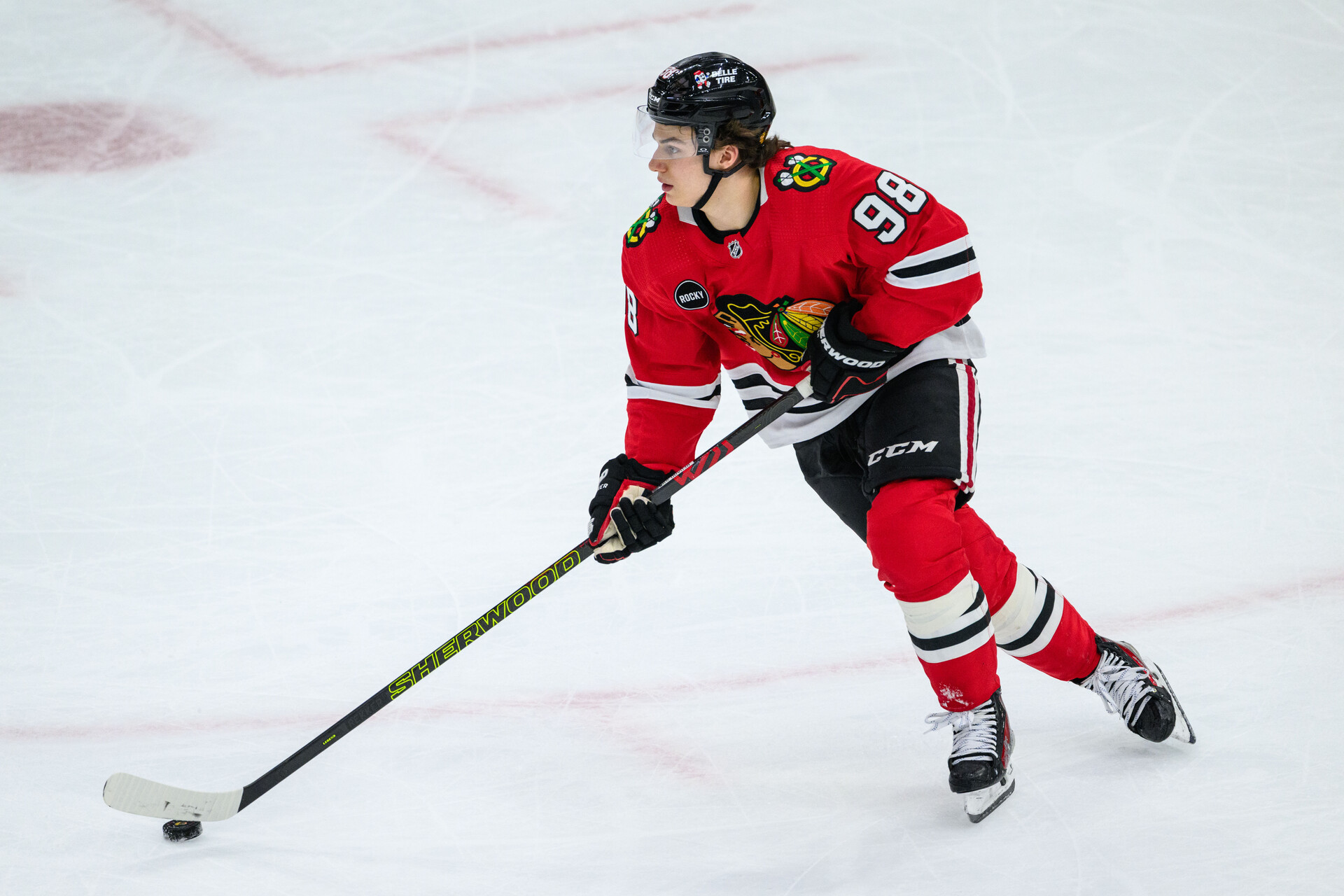 Dec 10, 2023; Chicago, Illinois, USA; Chicago Blackhawks center Connor Bedard (98) skates with the puck against the Washington Capitals during the third period at the United Center.