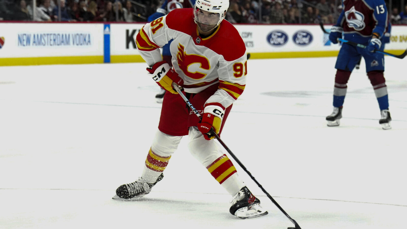 Dec 11, 2023; Denver, Colorado, USA; Calgary Flames center Nazem Kadri (91) prepares to shoot the puck in the third period against the Colorado Avalanche at Ball Arena.