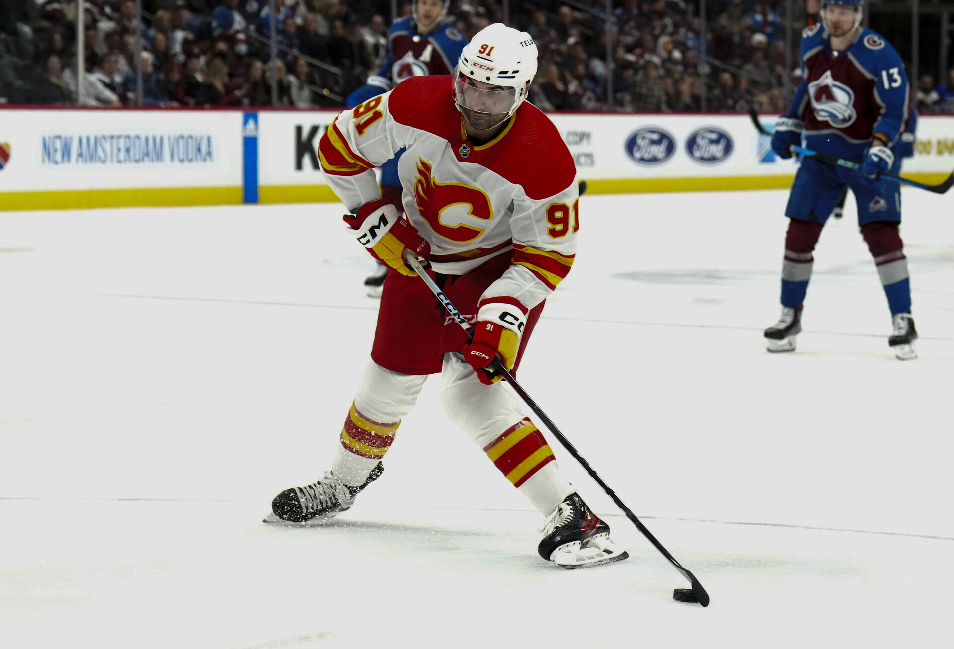 Dec 11, 2023; Denver, Colorado, USA; Calgary Flames center Nazem Kadri (91) prepares to shoot the puck in the third period against the Colorado Avalanche at Ball Arena.
