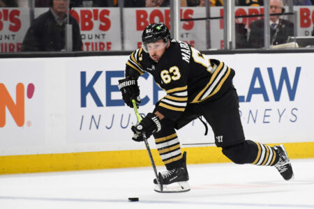 Dec 9, 2023; Boston, Massachusetts, USA; Boston Bruins left wing Brad Marchand (63) skates with the puck during the first period against the Arizona Coyotes at TD Garden.