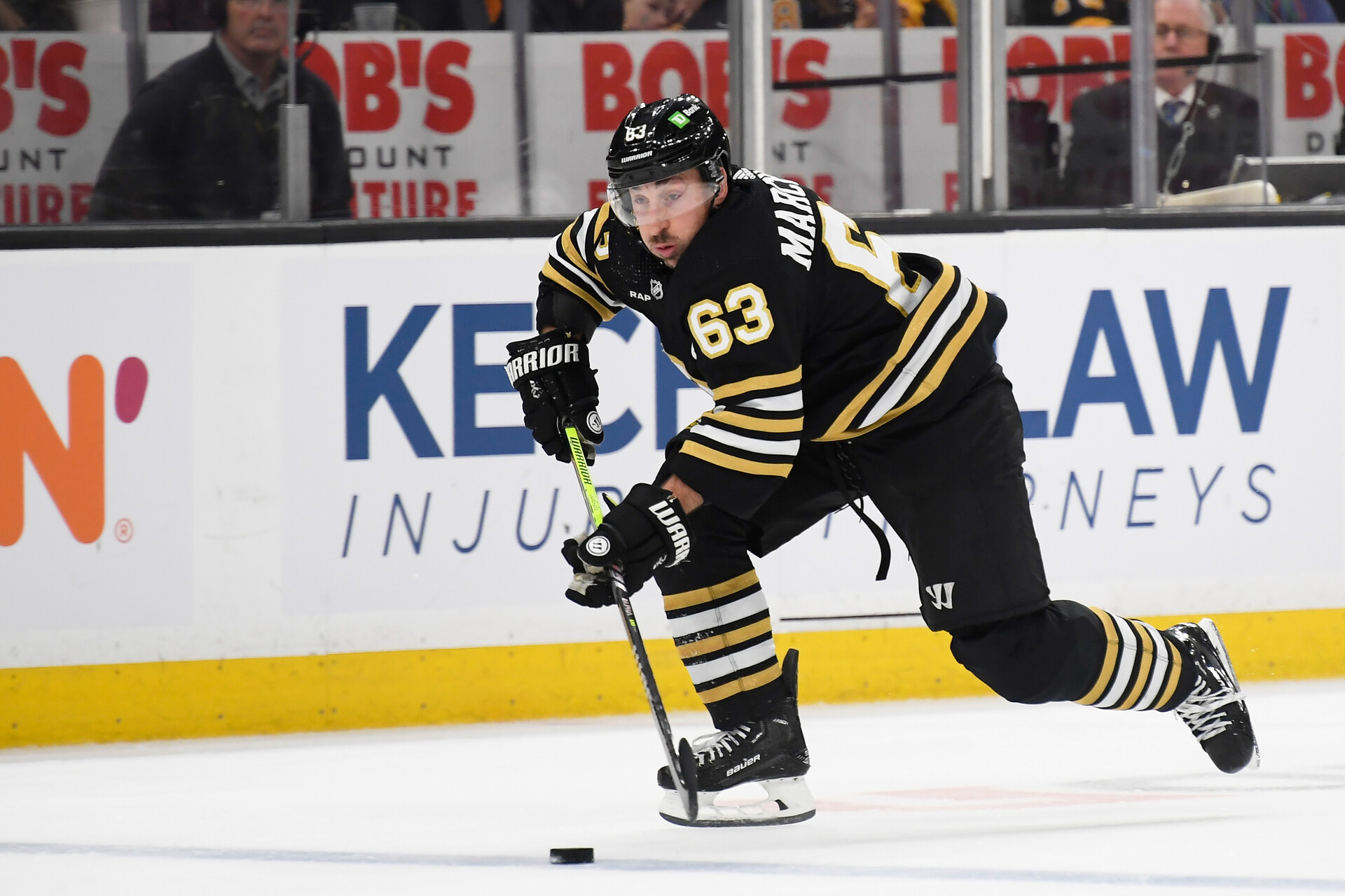 Dec 9, 2023; Boston, Massachusetts, USA; Boston Bruins left wing Brad Marchand (63) skates with the puck during the first period against the Arizona Coyotes at TD Garden.