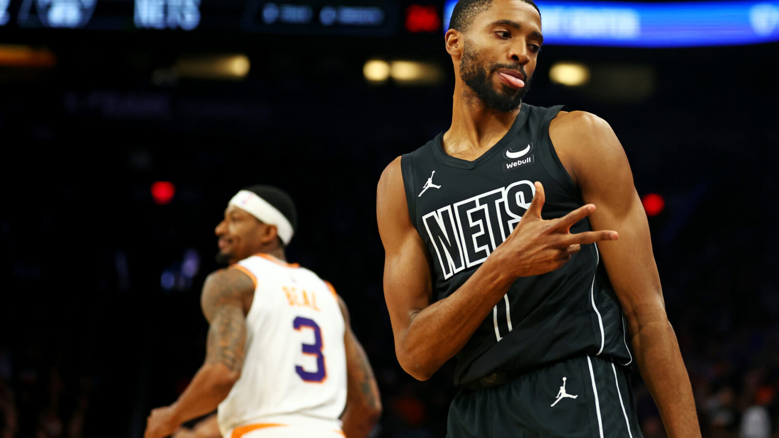 Dec 13, 2023; Phoenix, Arizona, USA; Brooklyn Nets forward Mikal Bridges (1) reacts after a play during the first quarter of the game against the Phoenix Suns at Footprint Center.